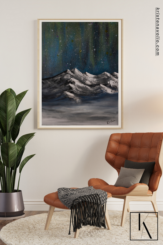 Bohemian chic aesthetic with framed painting of mountains with northern lights in the background